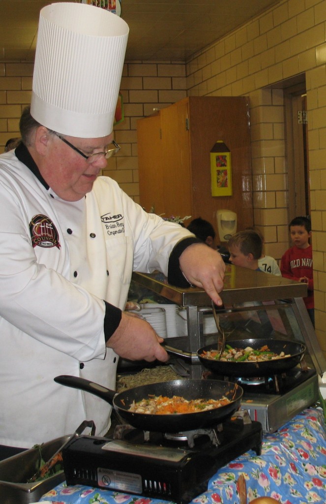 TAHER'S CORPORATE CHEF Brian Renz cooked up some chicken stir-fry for Mountain Lake Public School students on Friday, January 31, 2014, in celebration of the start of the Chinese New Year.