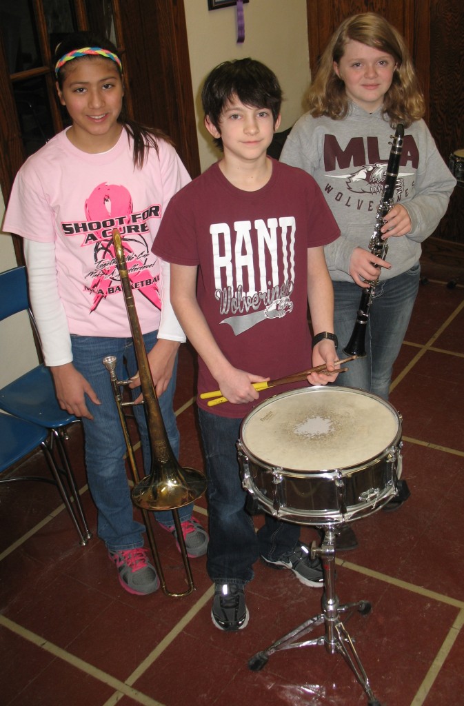 EARNING "EXCELLENCE AWARDS" were, from left, Janessa Johnson (trombone solo), Ethan Klassen (snare drum solo), Amy Bartsch (clarinet solo) and at right, Sophie Carrison (alto sax solo).