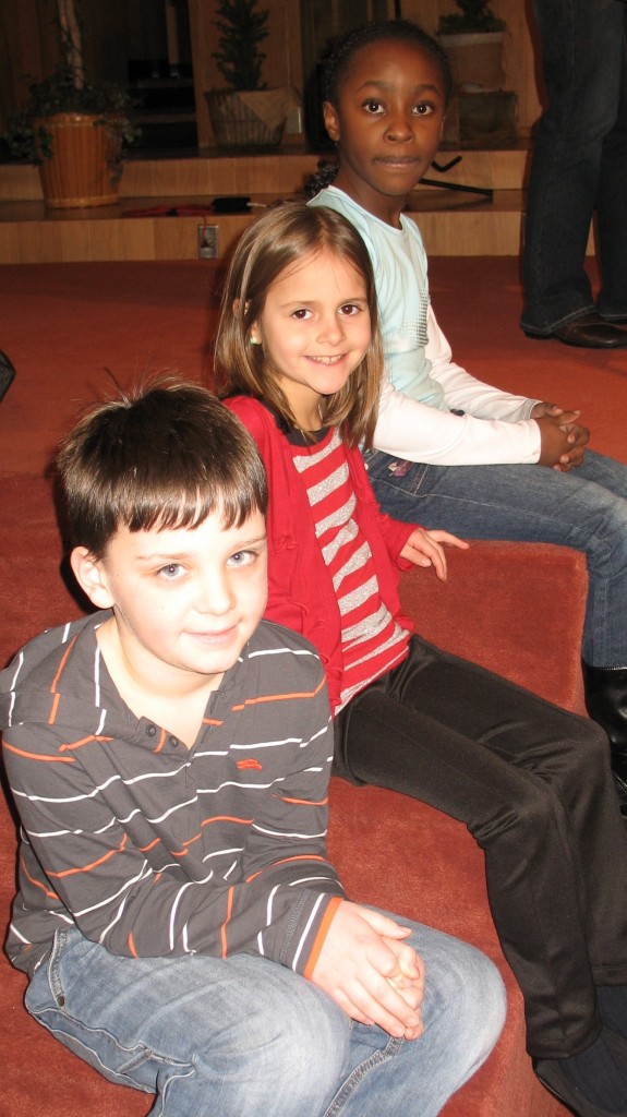 TOP SPELLERS IN second grade. From top-to-bottom, Karen Mugaisi, first; Megan Johnson, second and Tyler Dick, third.