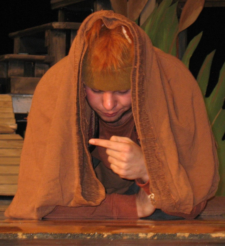 BRER FOX (JOSH Grev), although hidden under a brown sack, reacts to the conversation going on around him.