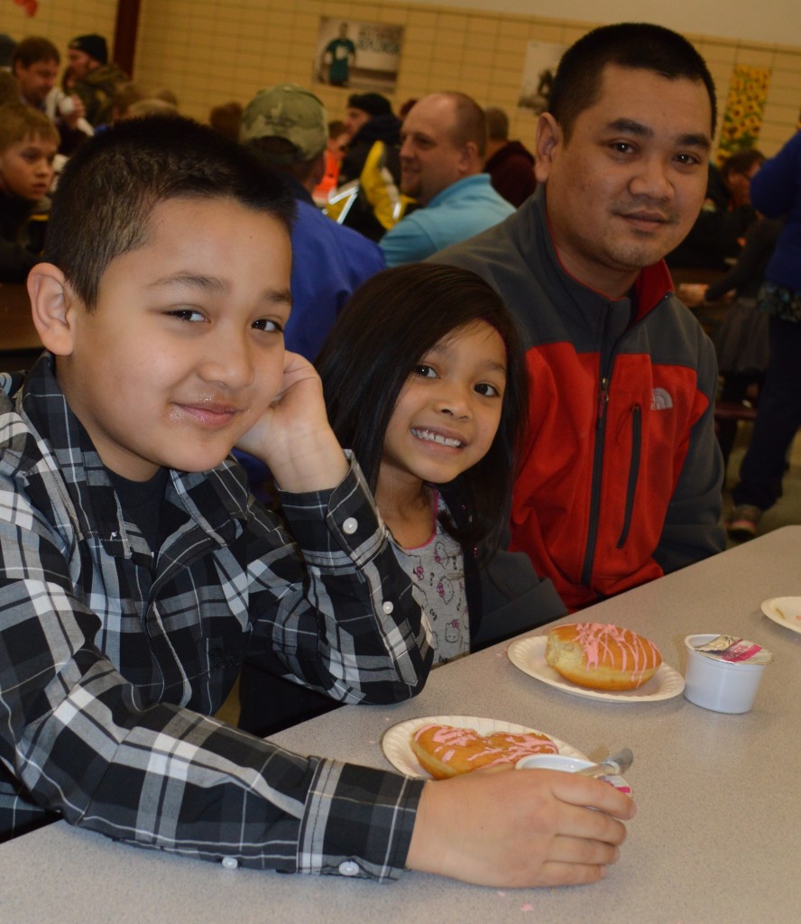 FROM LEFT, MOUNTAIN Lake Public Elementary second-grader, Andres; his sister and kindergarten student, Aleena - and their dad, Tino Vetsouvanh.