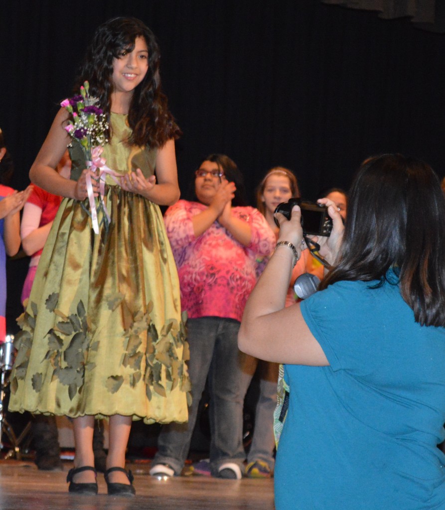 VICTORIA NAVARETTE'S PROUD mom was on hand in the audience to present her a bouquet of flowers and take time for a photo op of the winner.