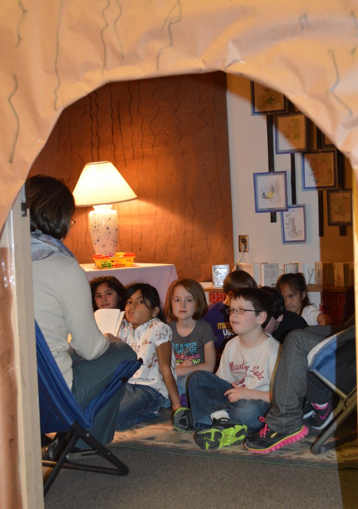 NESTLED DEEP IN the comfy and welcoming confines of "Rabbit's Reading Burrow" in the elementary library, first-graders listen to their teacher, Kim Blomgren, as she reads to them.