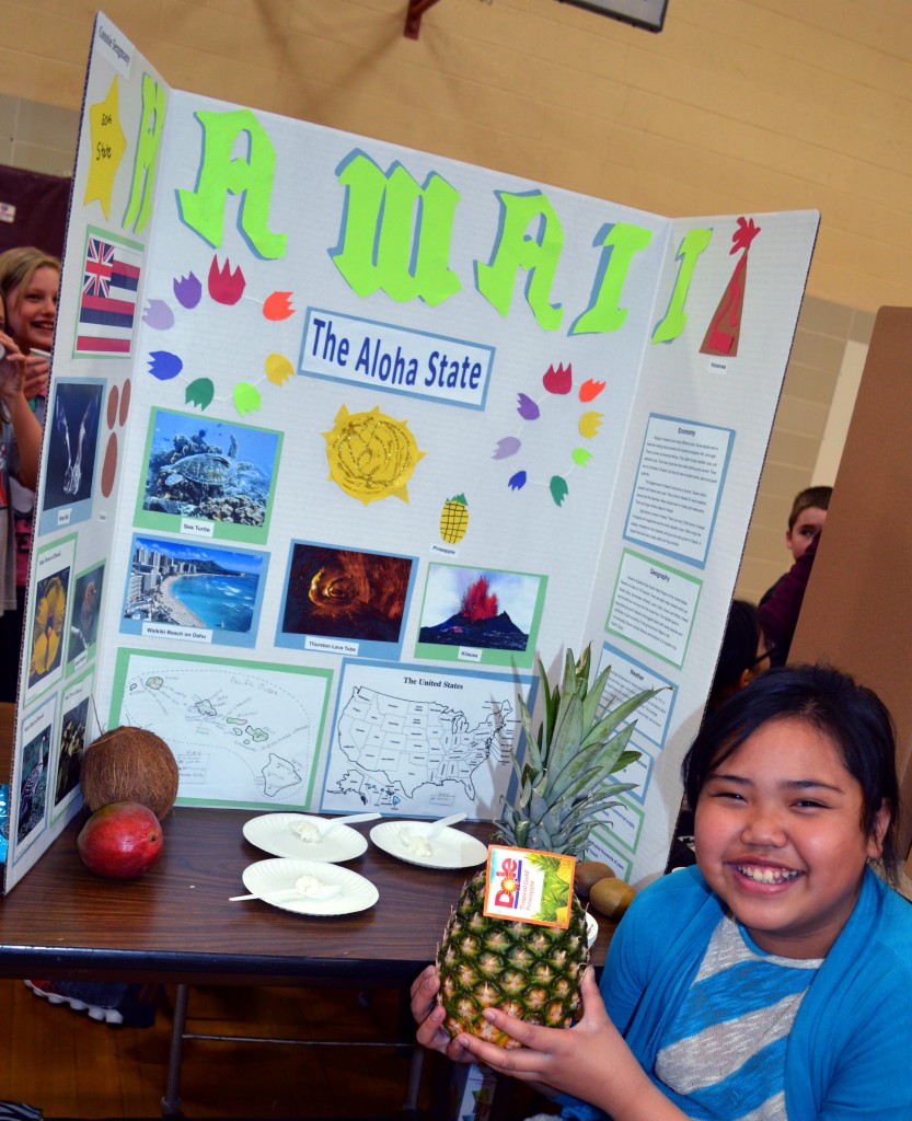 CONNIE SENGMANY WAS one of just a few of the fourth-graders that had visited the state she studied - Hawaii. Connie found it interesting that Hawaii has a population of 1,567,899 on its group of islands. Of course, the pineapple is a popular fruit grown on the islands. Connie featured another Hawaiian crop - coconut - with her coconut pudding samples.