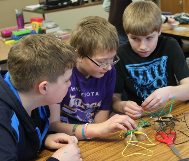 A TRIO OF great minds coming together to harness potato power. From left, Bryce Adrian, Peyton Buller and Abraham Stoesz.