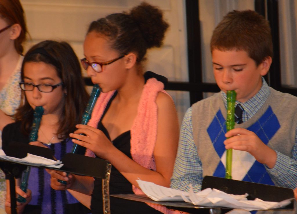 FROM THERE, THE fourth-grade recorder band moved on to their own number, "Take the A, B, C or G Train," by Paul Jennings. From left, Olivia Klassen, Shailin Ohrtman and Kade Wassman.