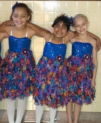 ANOTHER EXCITED GROUP of young dancers set to take their talents onto the stage in front of the spotlight. From left, Kaila Blom, Carly Hernandez and Khya Boldt.