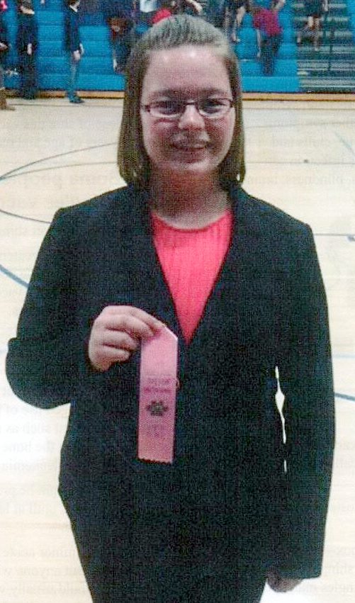 EIGHTH-GRADER KAYLA Vonk and her sixth-place Varsity ribbon in Informative Speaking.